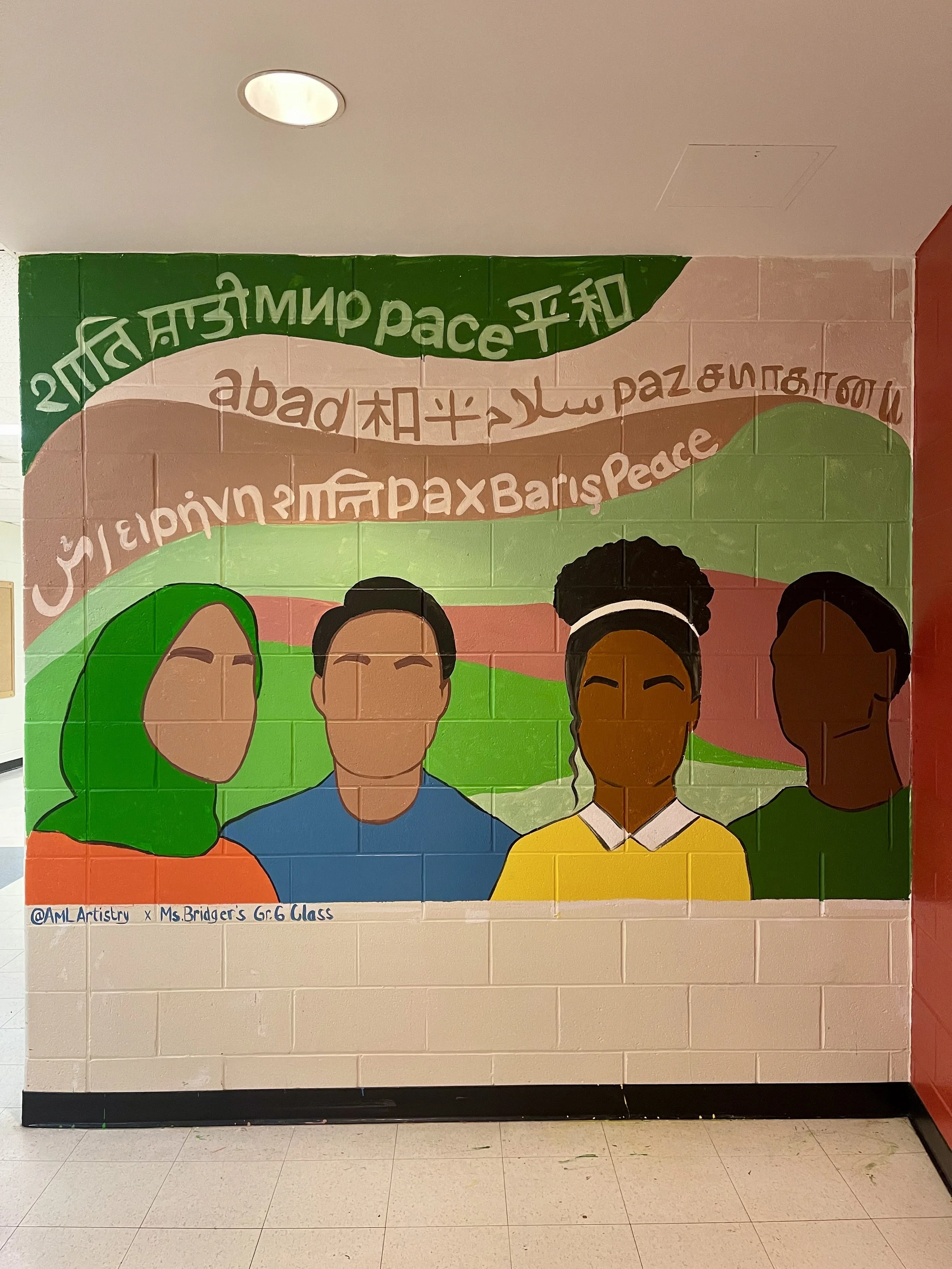 Colorful mural featuring four diverse individuals with a background of rainbow-colored stripes. The mural includes words for peace in multiple languages and artist information at the bottom that reads '@AMLartistry x Ms. Bridger's Gr. 6 Class'.